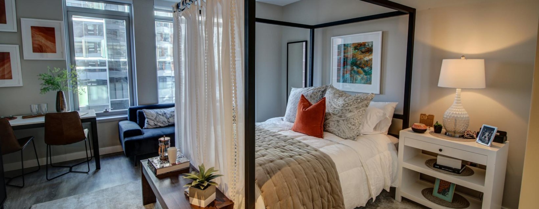 a bedroom with a bed and a desk