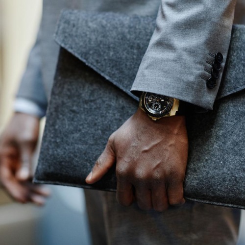 man in a business suit with a pouch