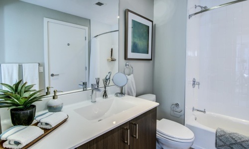 a bathroom with a tub toilet and sink