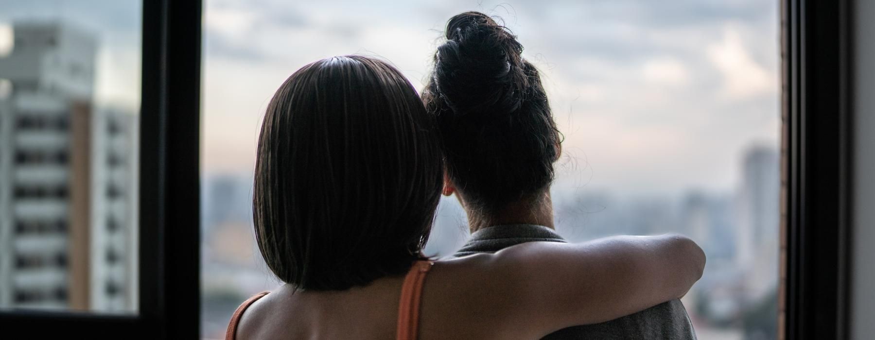 women looking at a view of the city