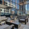 a rooftop lounge with a fire pit