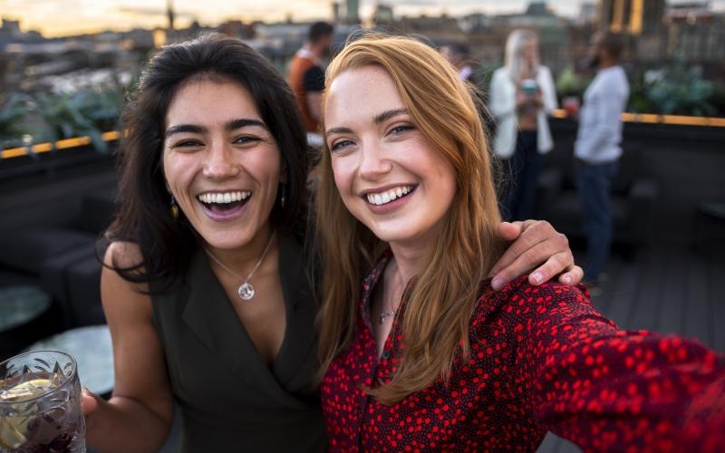 two women smiling at camera