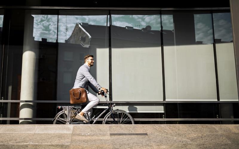 A beautiful community at the heart of all your passions a man riding a bicycle