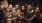a group of people drinking wine