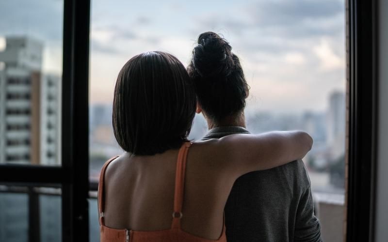 women looking at a view of the city